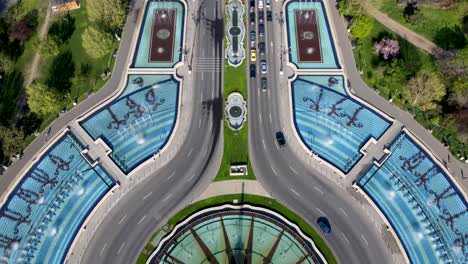 drone tilt up over bucharest fountains reveals palace of parliament