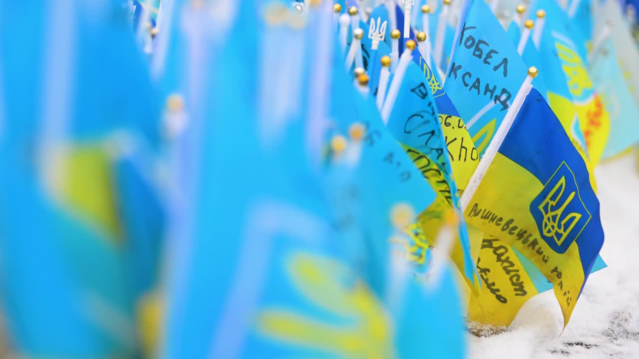 A narrow focus on Ukrainian flags filling Kyiv’s Independence Square, Ukraine, honoring fallen soldiers of the Ukraine-Russia war—a powerful tribute of remembrance and resilience.