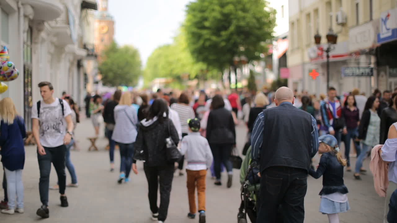 Mass Of People Walking In The City. VINNISA, UKRAINE - MAY 2017: people crowd walking on busy street on daytime
