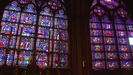 famed stained glass windows inside the notre dame cathedral in paris