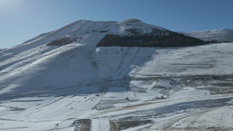 A-drone-footage-over-Castelluccio---Italy-during-winter-period-with-snow