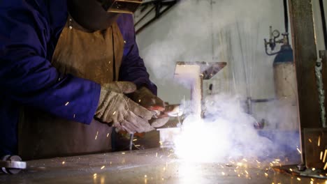 Welder-welding-a-metal