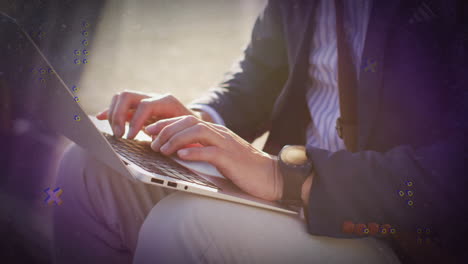 typing on laptop, person with colorful digital animation overlay in school