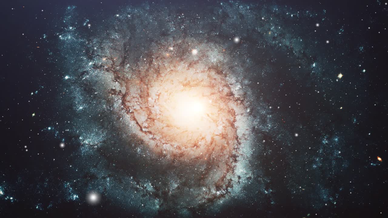 a galaxy spinning and moving across the stars in the universe