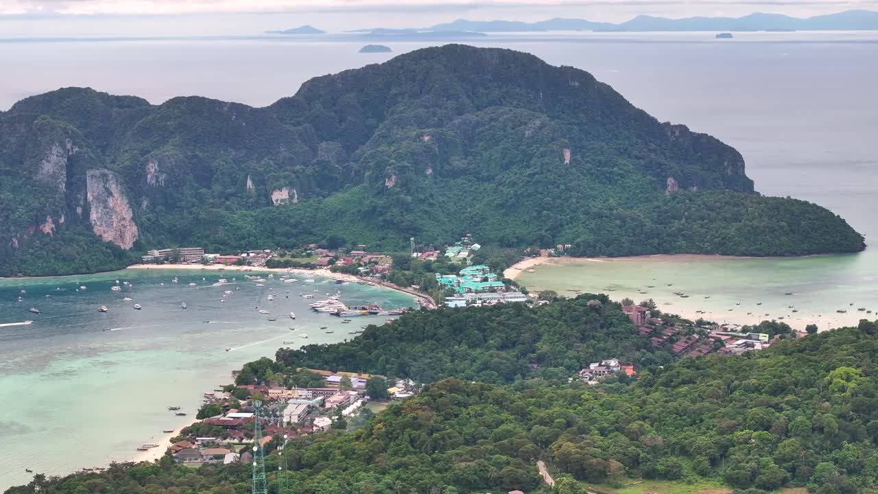 Aerial panoramic of Koh Phi Phi Don settlement and scenic cliffs. Thailand drone