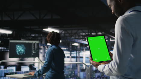 data center engineers on industrial platform using isolated screen device
