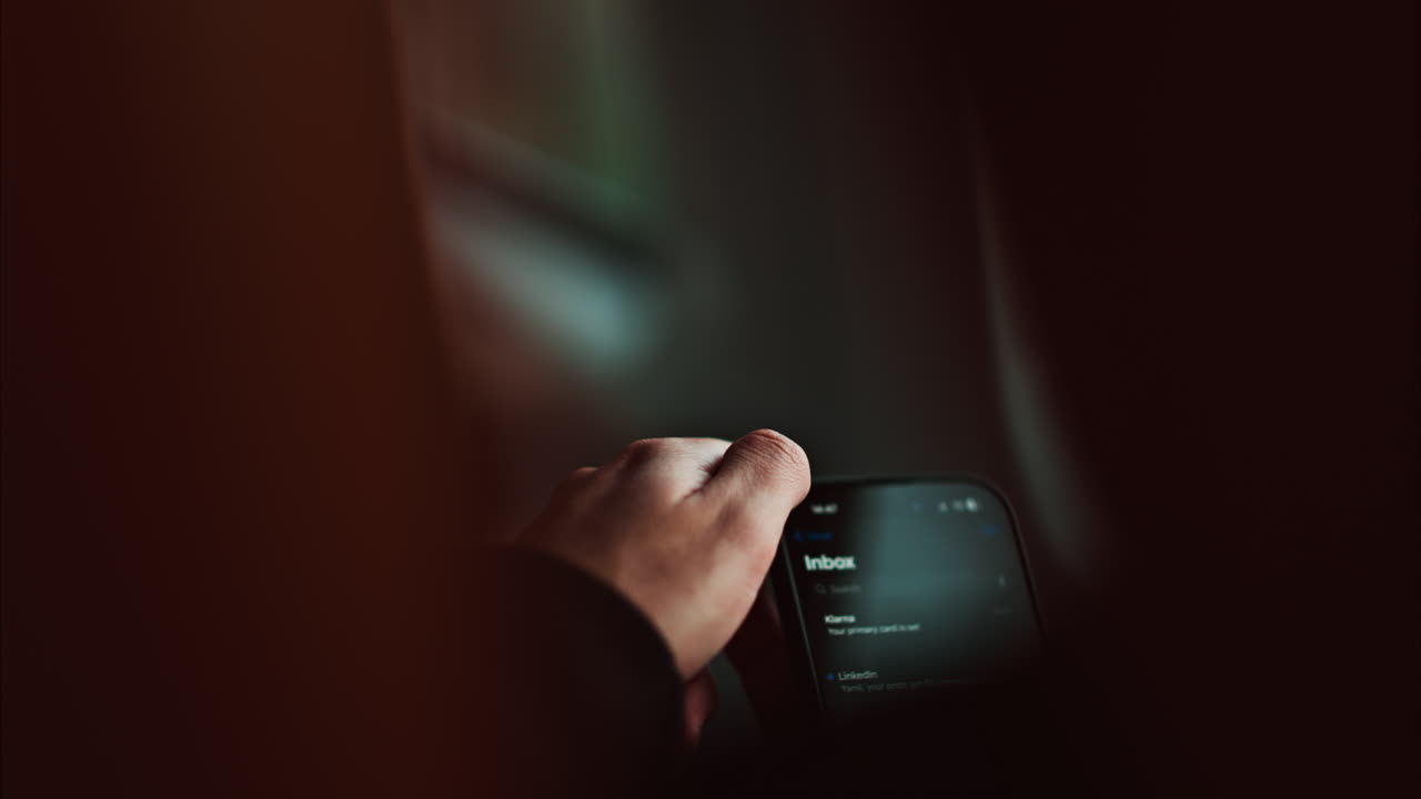 Man scrolling on mobile phone while traveling in train in France