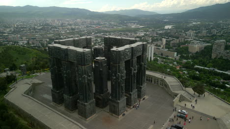 the chronicle of georgia monument overlooking the city of tbilisi
