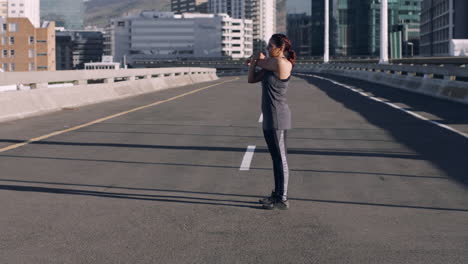 fitness, city and woman stretching in the street