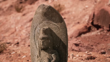 ancient statue on the rocks desert