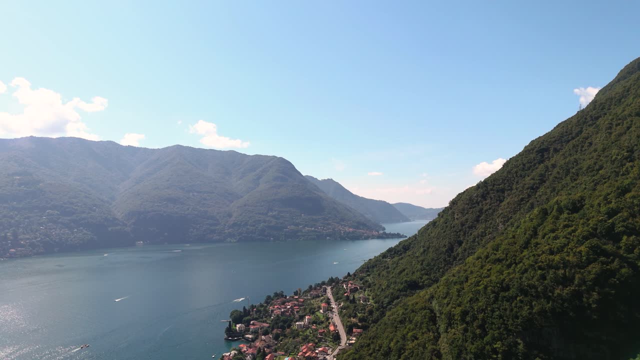 Fly sideways up along mountain, view of Lake Como, mountains and more, Italy