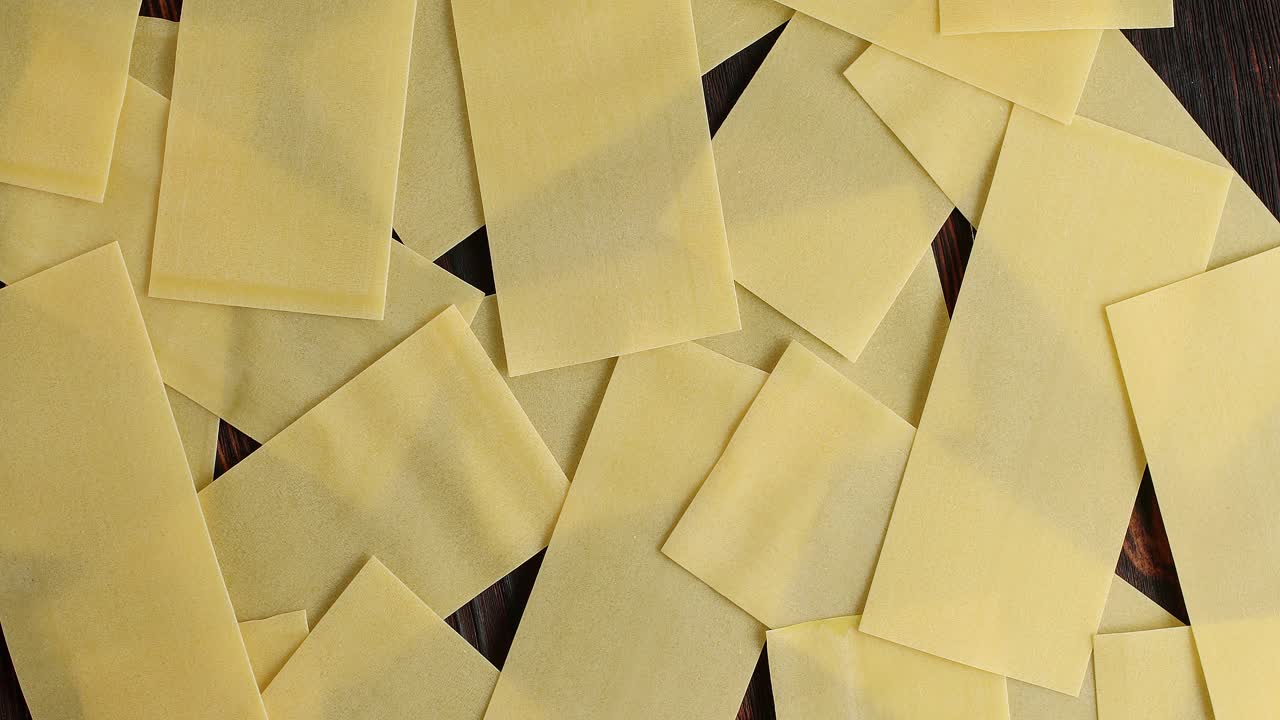 Heap of lasagna sheets on table