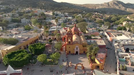 panoramic view of san sebastian church and plaza principal in bernal, querétaro, mexico - aerial drone shot