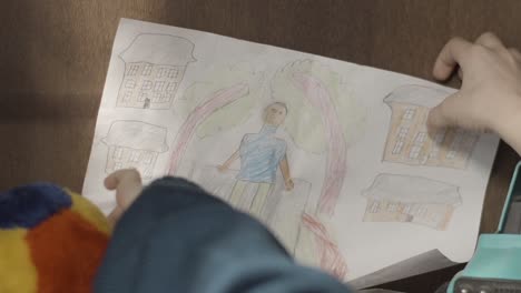 child's drawing of houses and a person