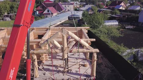 log cabin construction with crane
