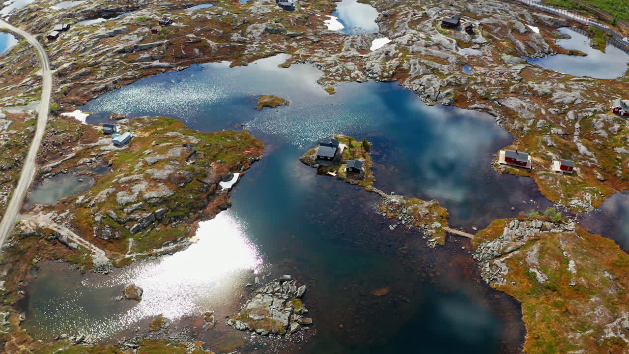 Aerial drone shot of the nordic rocky landscape of the town of Bjørnfjell at the Swedish border.
High view of the arctic tundra and vast wilderness.