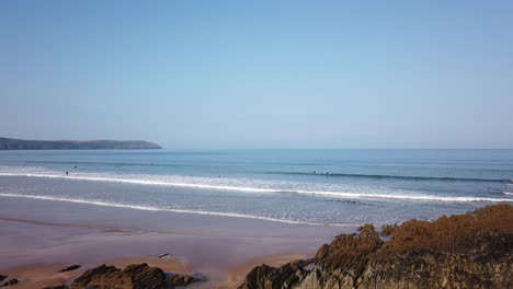 time lapse of surfers in the waves on a beautiful summer’s day