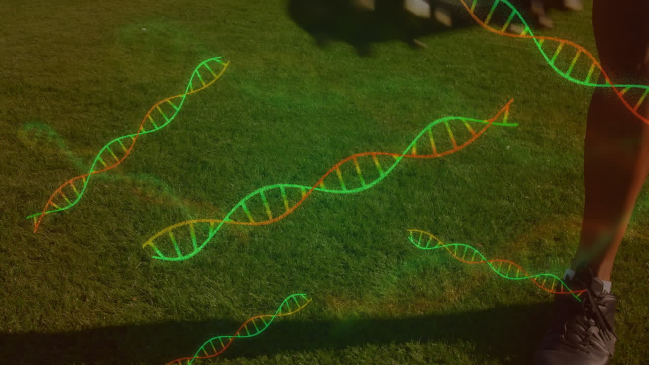Male soccer player controlling soccer ball on grass, showing sports science with DNA helix graphics