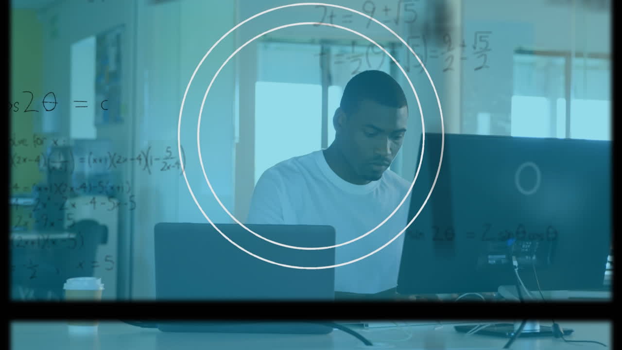Animation mathematical formulas over businessman using computer