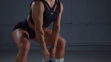 woman performing kettlebell swing exercise