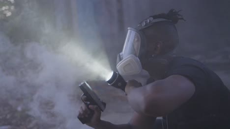 a man in a gas mask scans a smoky, abandoned area with a flashlight while holding a pistol. suspenseful, cinematic action vibe