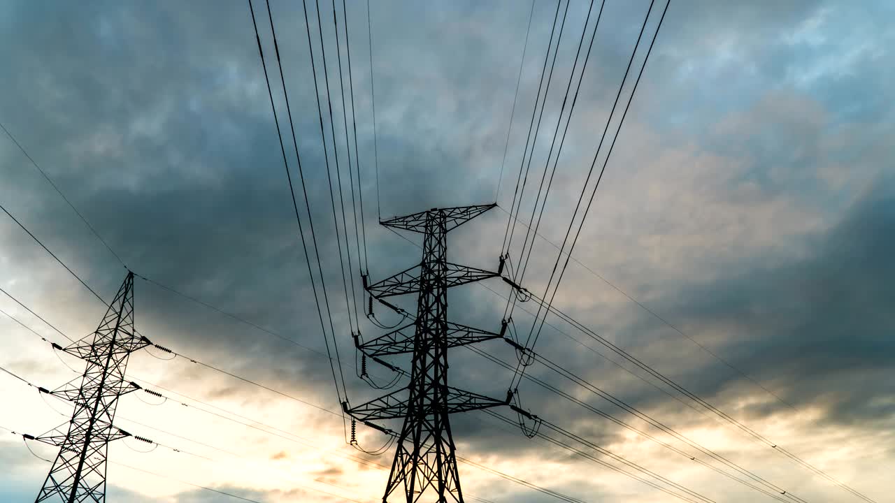 Timelapse silhouette of high voltage electrical pole structure