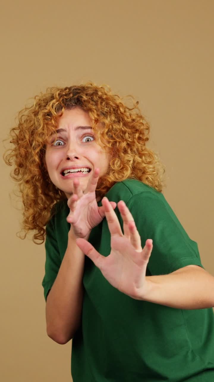 A woman reacting with intense fear or shock