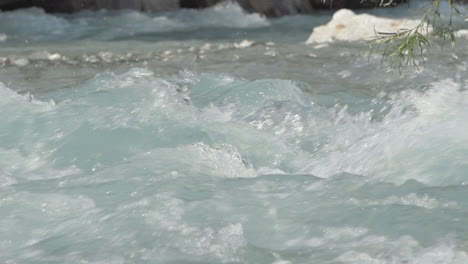 detail shot in slowmotion of how the water falls in the venosc river, les deux alpes