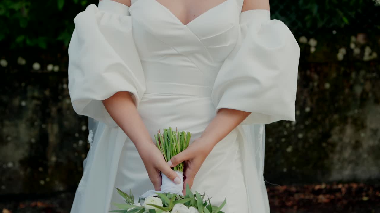 Bride holding a beautiful white wedding bouquet