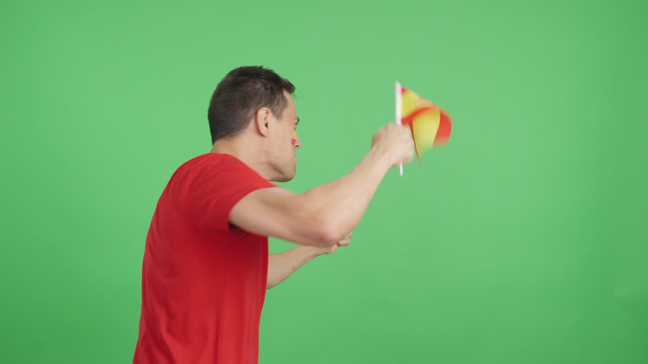 Rear view of a man waving a spanish pennant