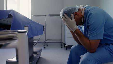 Sad-male-surgeon-sitting-on-the-chair