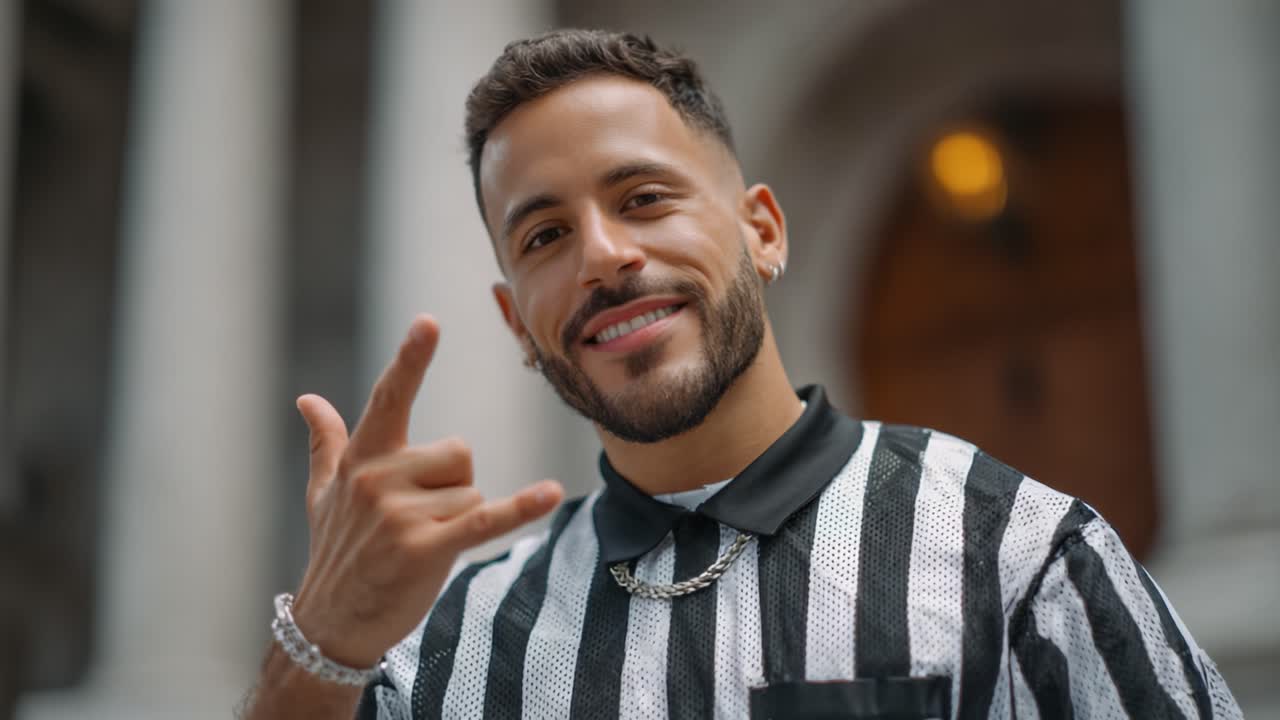 A Confident Young Man in a Striped Shirt with a Playful Gesture, Smiling Cheerfully Against an Elegant Background in Two Captivating Frames