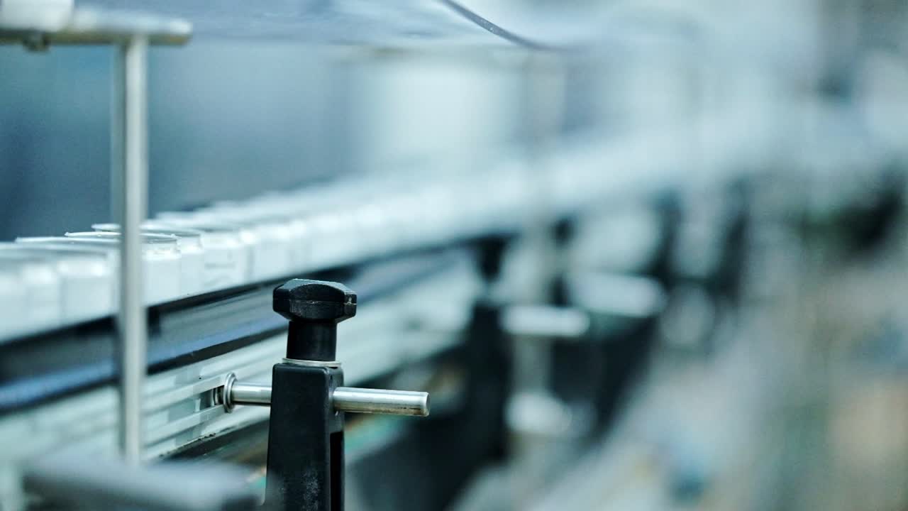White cans in a production line