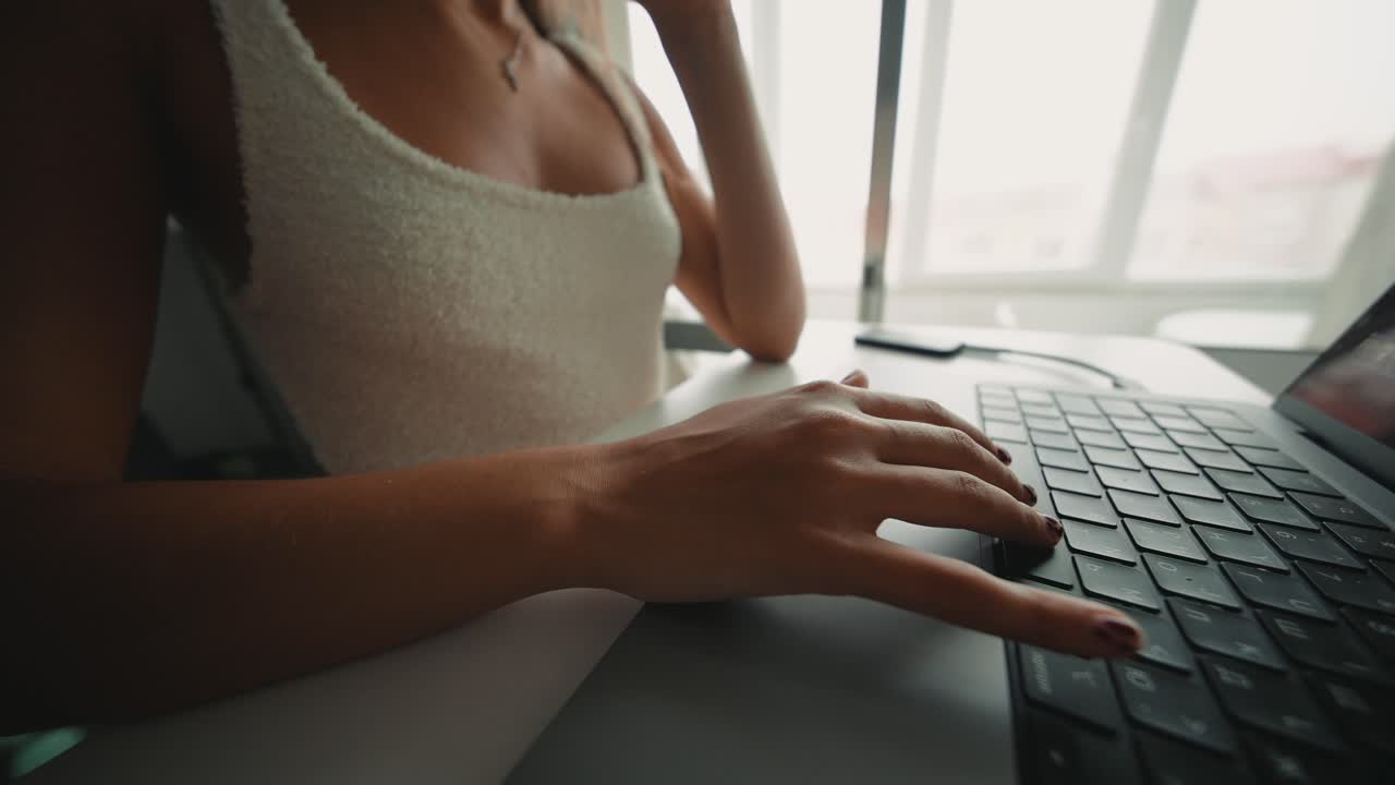Woman Typing on Laptop