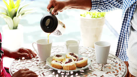 Senior-couple-having-coffee-at-home