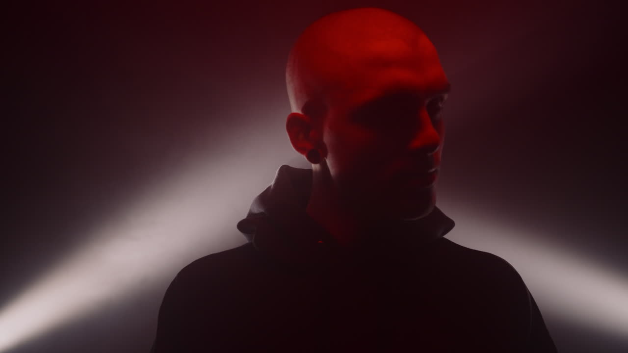 Dramatic Portrait of a Bald Man in Red Light