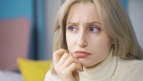 Thoughtful-young-woman-with-problems-is-unhappy-and-confused.