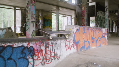 skateboard on the wall in a ruined building.