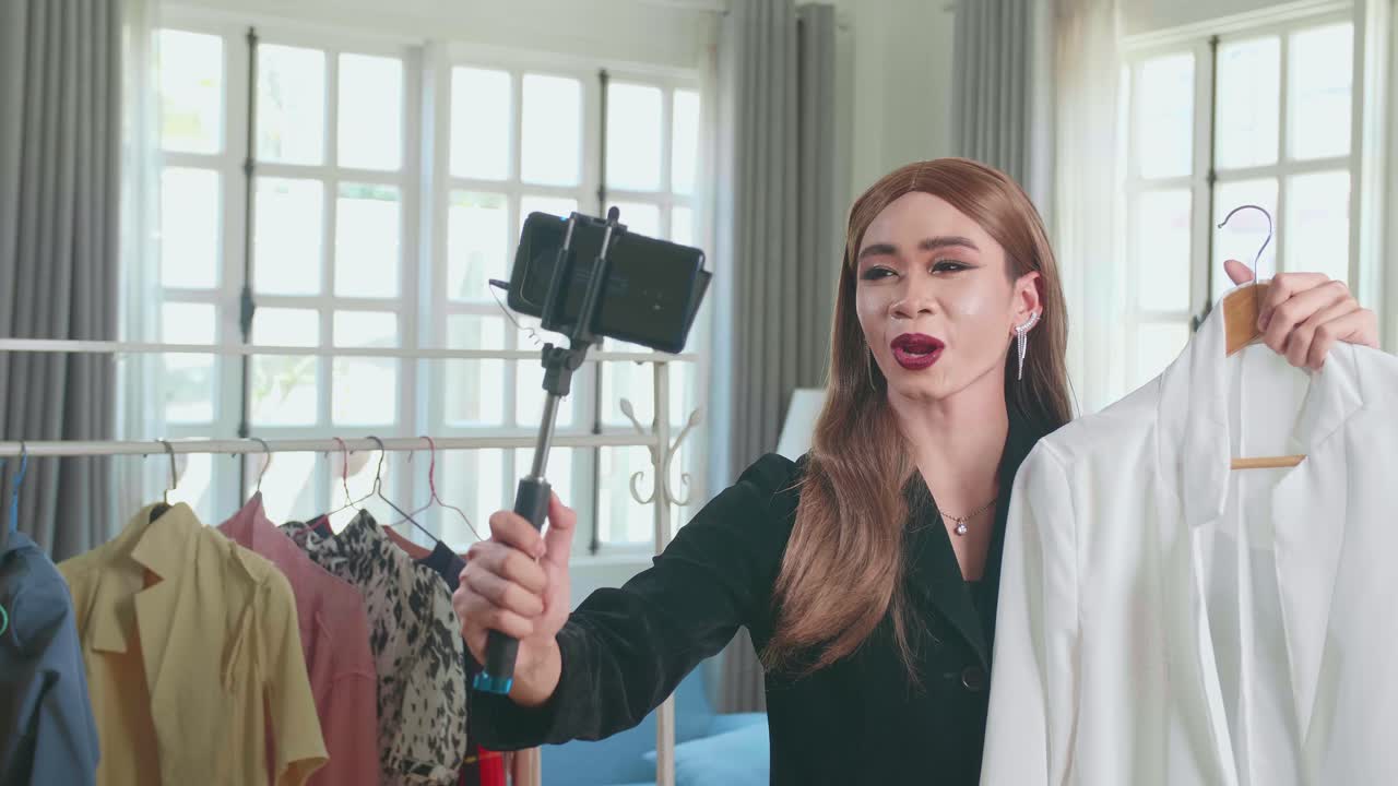 Young Transgender Woman Fashion Blogger Selling Clothes Online By Live Streaming On Mobile Phone, Selfie