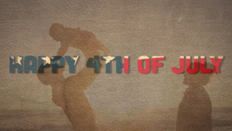 independence day text against silhouette of father carrying his child