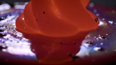 captivating fluid dynamics: a mesmerizing presentation of color and movement in viscous mediums captured in two stunning frames