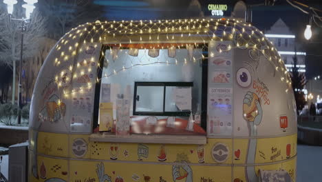 cozy winter food stand at night