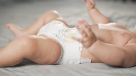 close-up-of-female-hands-wearing-diapers