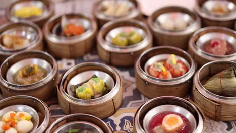 assorted dim sum dishes displayed on a table