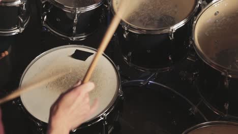 young man practicing his electronic drumkit at home - close up shot