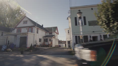 wilson, ny, usa, october 2021: drive forward on a road through a typical american city.