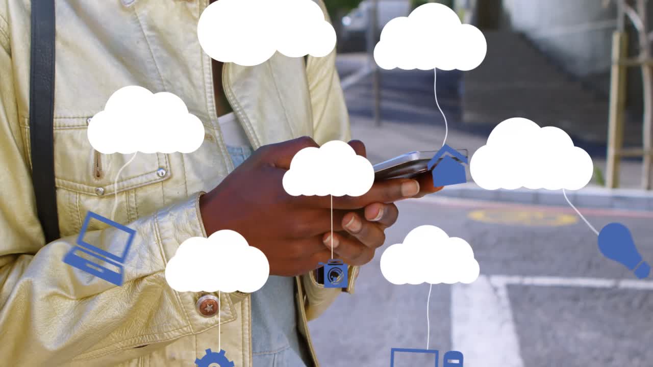 Animation of clouds with electronic devices over african american woman using smartphone