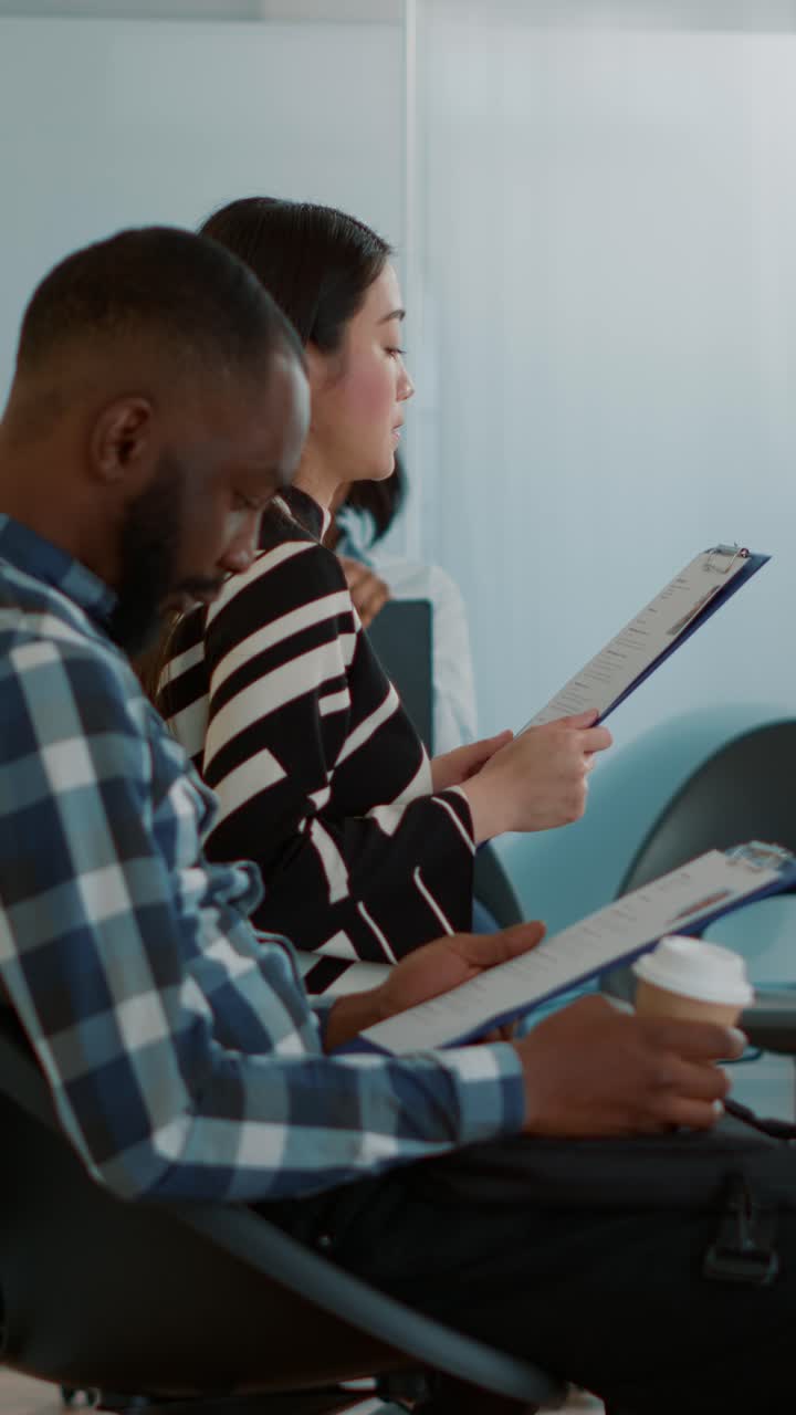 Job Applicants Waiting in Waiting Room for Job Interview
