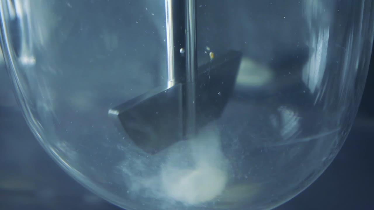 The procedures for corona virus testing are initiated in the laboratory. First mixes are prepared in a closed glass box.water vortex formed in beaker. magnetic mixing machine.