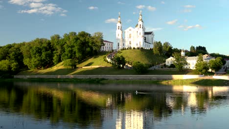 vitebsk, belarus. assumption cathedral church, town hall, church of resurrection of christ and dvina river in sunny summer day. pan, panorama